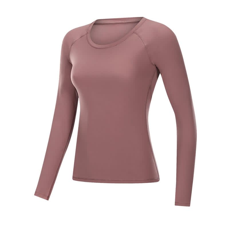 A long sleeve yoga top in a soft mauve colour, featuring a fitted design with a round neckline.
