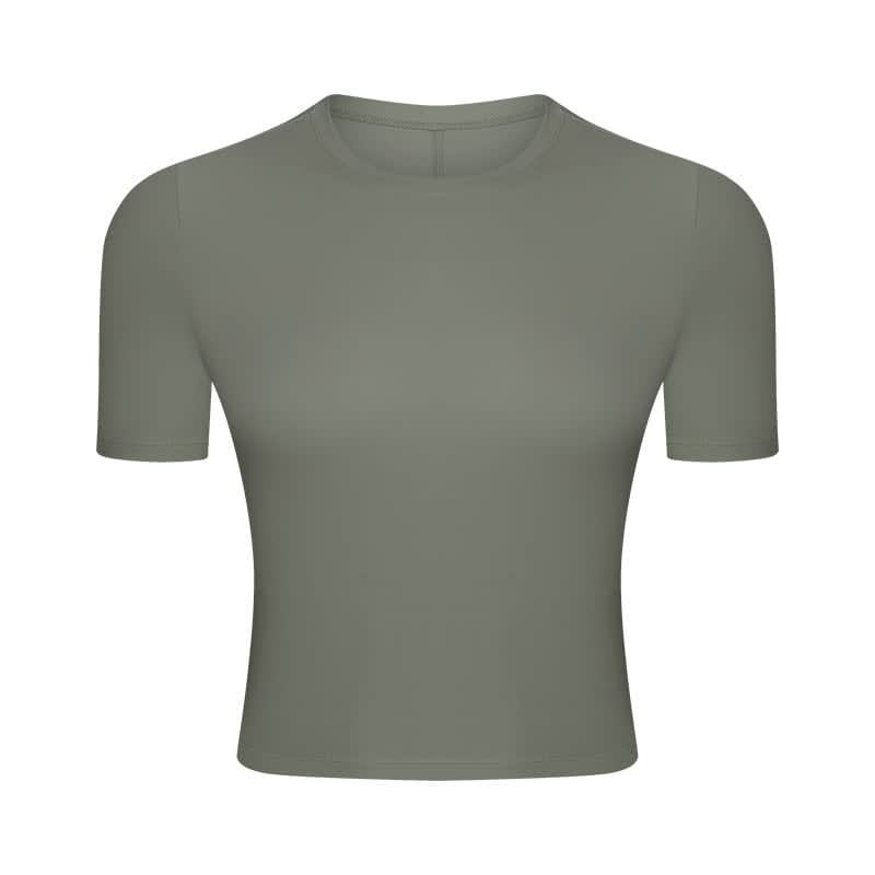 A short sleeve yoga top in a muted green shade with a fitted design and no visible logos.
