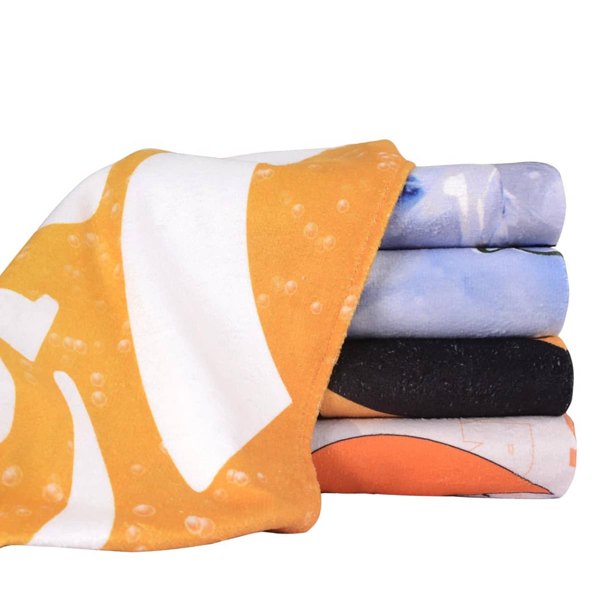 A set of colourful face washers stacked together, featuring orange, blue, black, and white patterns.