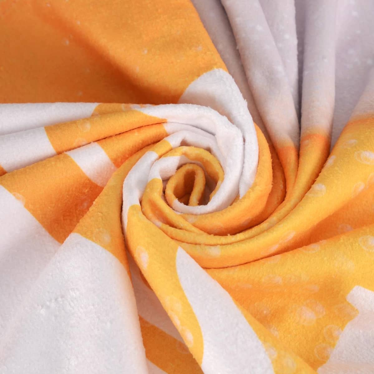 A soft face washer in orange and white, featuring a spiral design with a plush texture. It includes a logo.