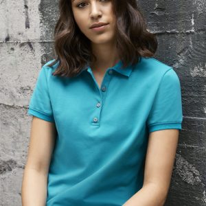 A turquoise women's short sleeve polo shirt featuring a collar and button detail, set against a textured grey background.