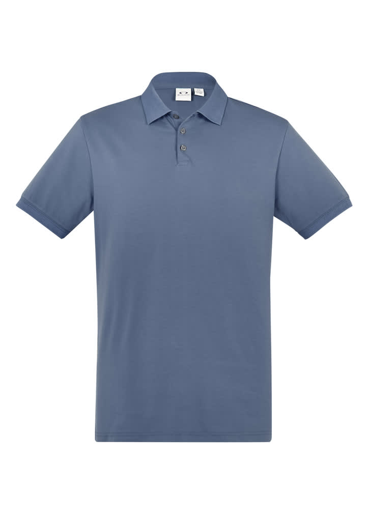 A short sleeve polo shirt in a soft blue colour, featuring a collar and three buttons, with a brand logo present.