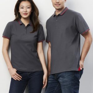 A grey short sleeve polo shirt featuring contrasting red accents, displayed on a male and female model.