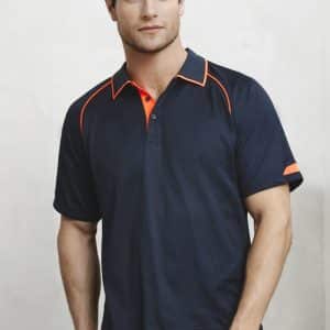 A men's polo shirt in navy blue with orange accents and a logo on the sleeve. Short sleeves and a collared neckline.