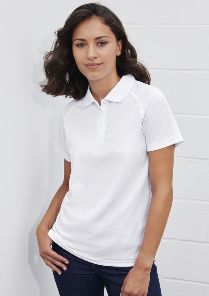A white women's short sleeve polo shirt with a collar, featuring a logo and a fitted design.