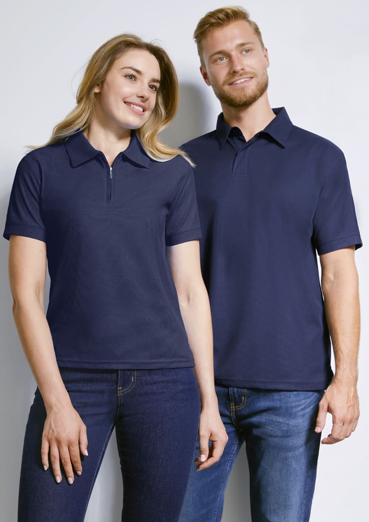 A women's short sleeve polo shirt in navy, featuring a classic collar and a logo. Styled alongside a men's polo shirt.