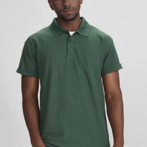 A green polo shirt with a collar and rolled sleeves on a model, featuring a logo.