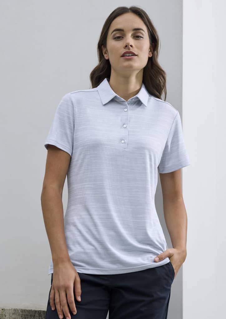 A women's short sleeve polo shirt in light grey with a collar and button detail, featuring a logo.
