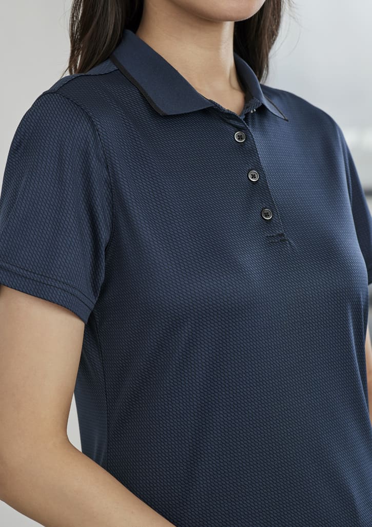 A navy blue women's polo shirt with a collar and buttons, featuring a subtle textured pattern.