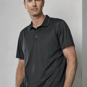 A man wearing a black short sleeve polo shirt with a collar. The shirt features a subtle texture and has a logo.