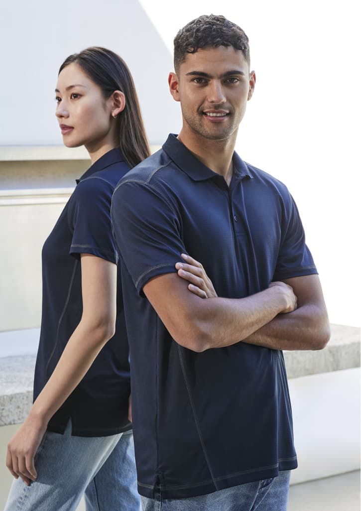 A navy short sleeve polo shirt featuring a classic collar and a logo, displayed by male and female models.