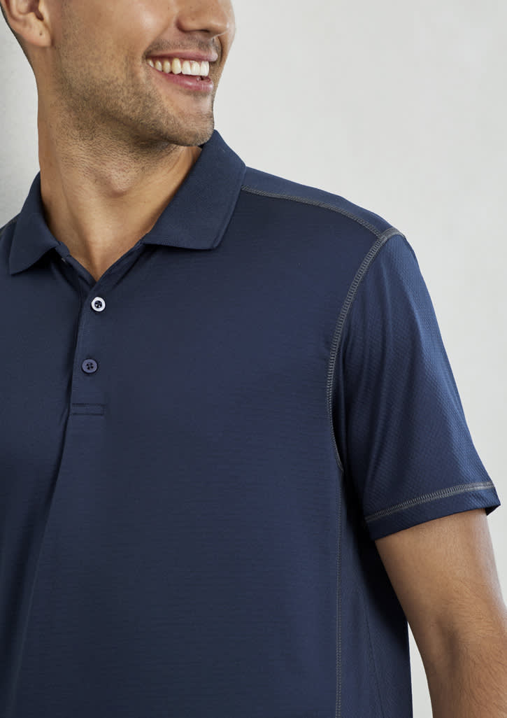 A navy blue short sleeve polo shirt with a collar and a logo. It features a textured fabric and contrasting stitching.