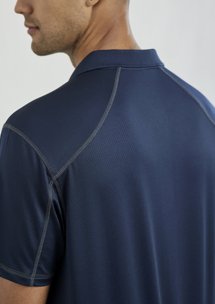 A men's short sleeve polo shirt in navy blue, featuring a subtle texture and a logo on the collar.
