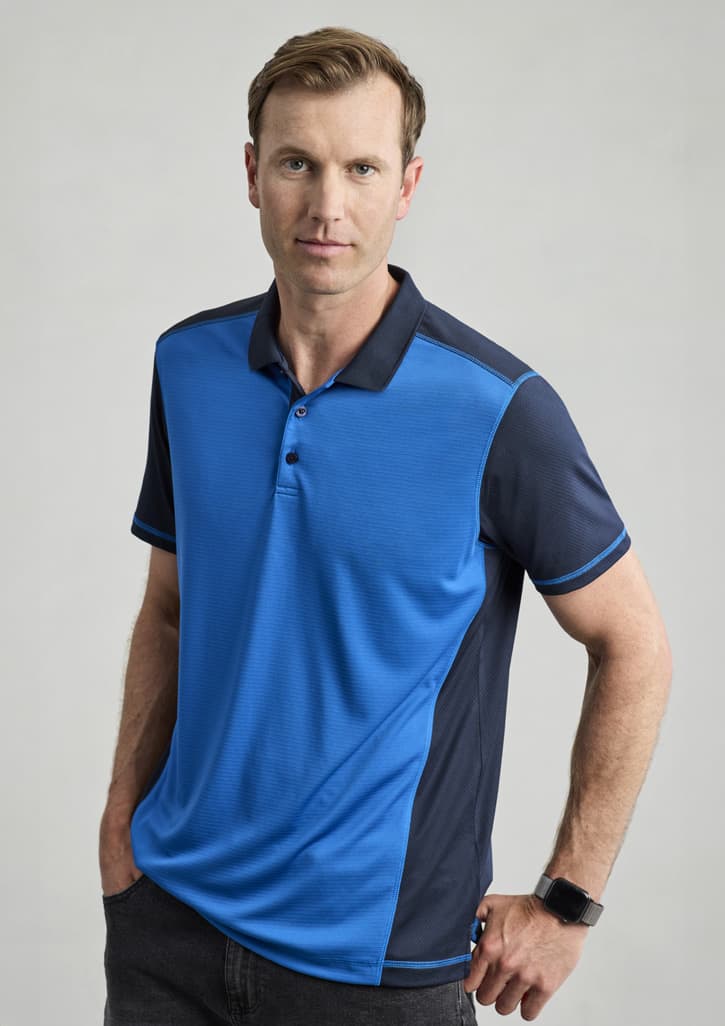 A men's short sleeve polo in blue with navy accents, featuring a logo on the chest.