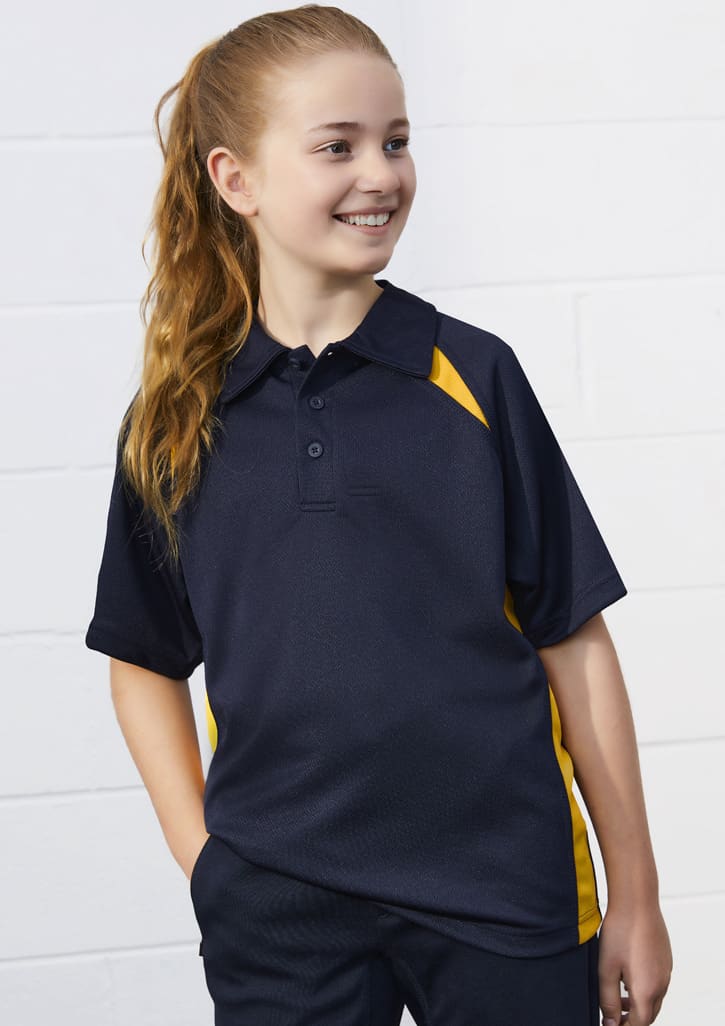 A kids' short sleeve polo shirt in navy blue with yellow accents, featuring a logo on the chest.