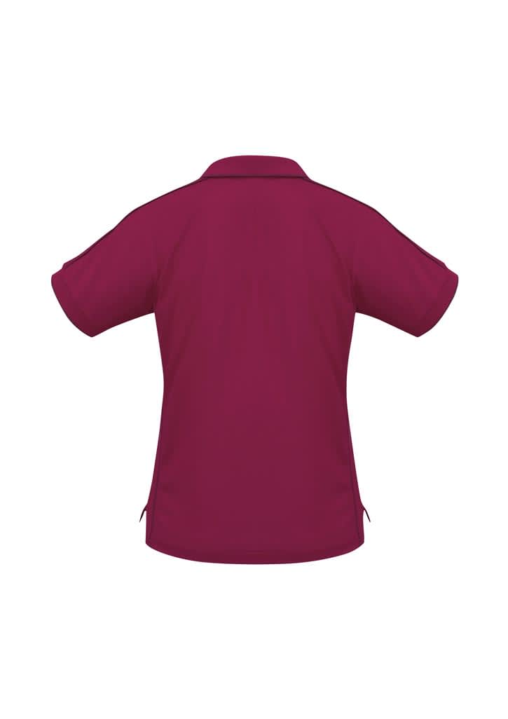 A burgundy women's polo shirt with a short sleeve design and a collar, featuring a logo.