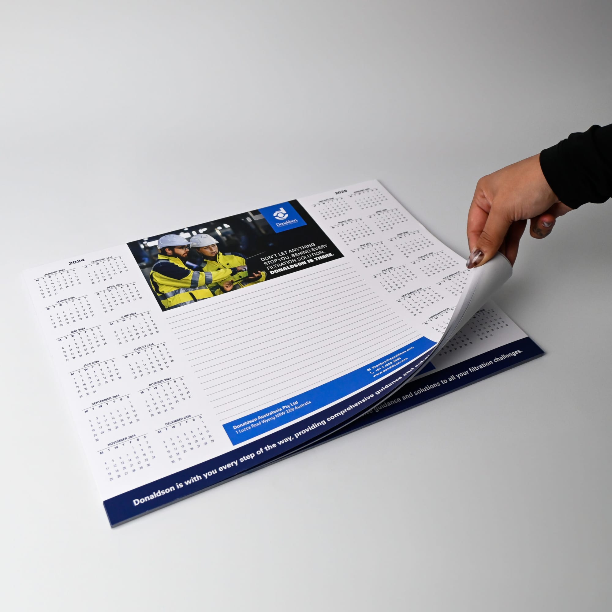 A3 notepad with 50 leaves, featuring a grid layout and space for notes, predominantly in white with blue accents.