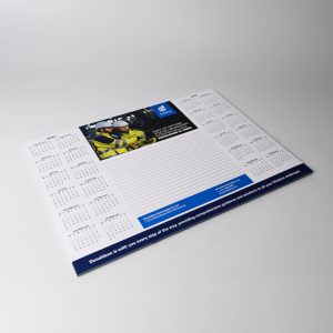 A3 note pad with a white background, featuring a calendar layout and space for notes, and includes a logo.