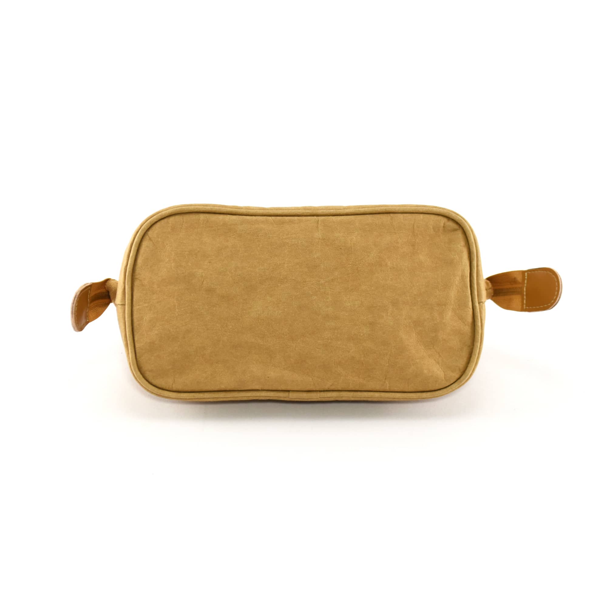 A kraft paper cosmetic bag in a warm tan colour with side handles and a smooth finish. It features a subtle branding element.