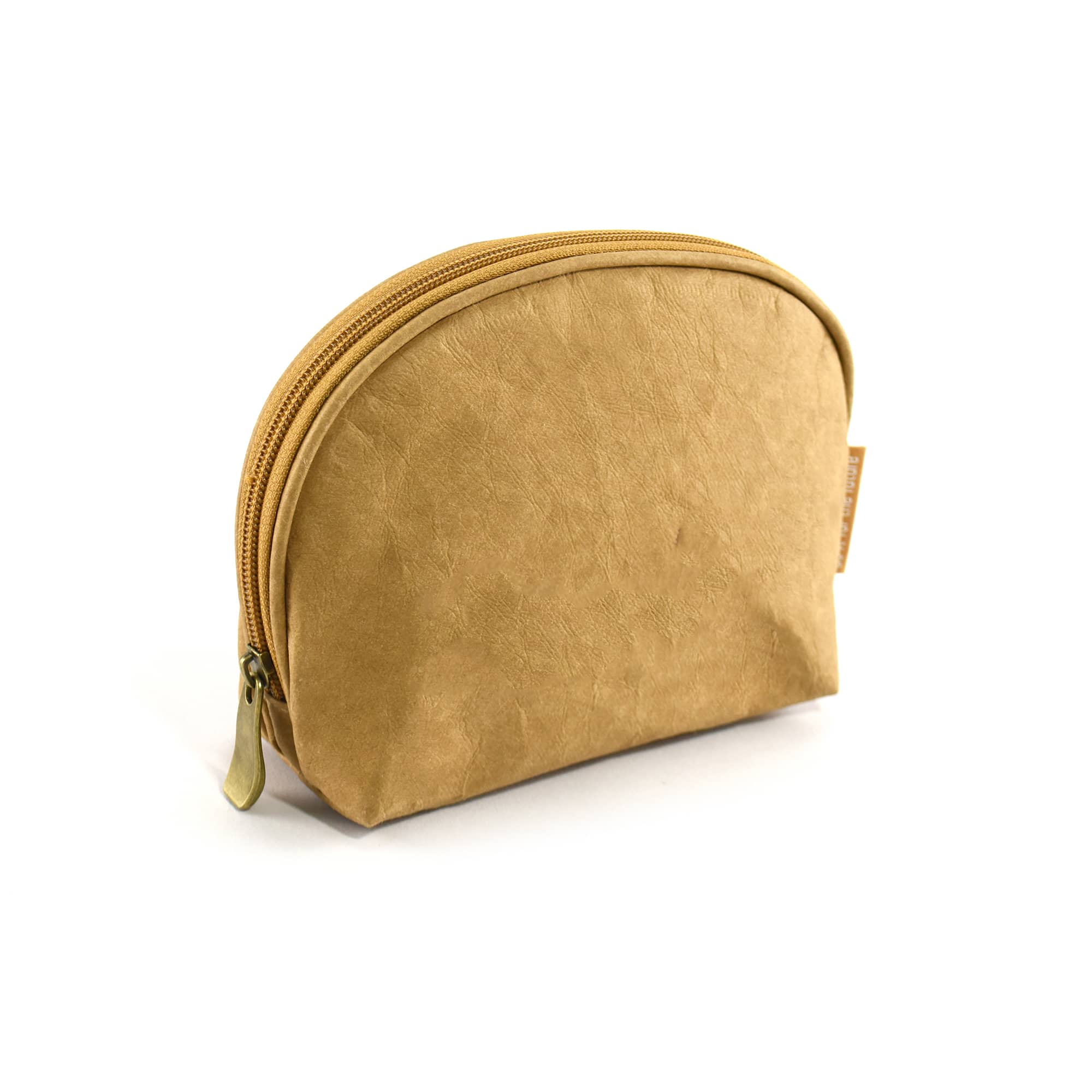 A tan kraft paper cosmetic bag with a rounded shape and zip closure, featuring a small logo.