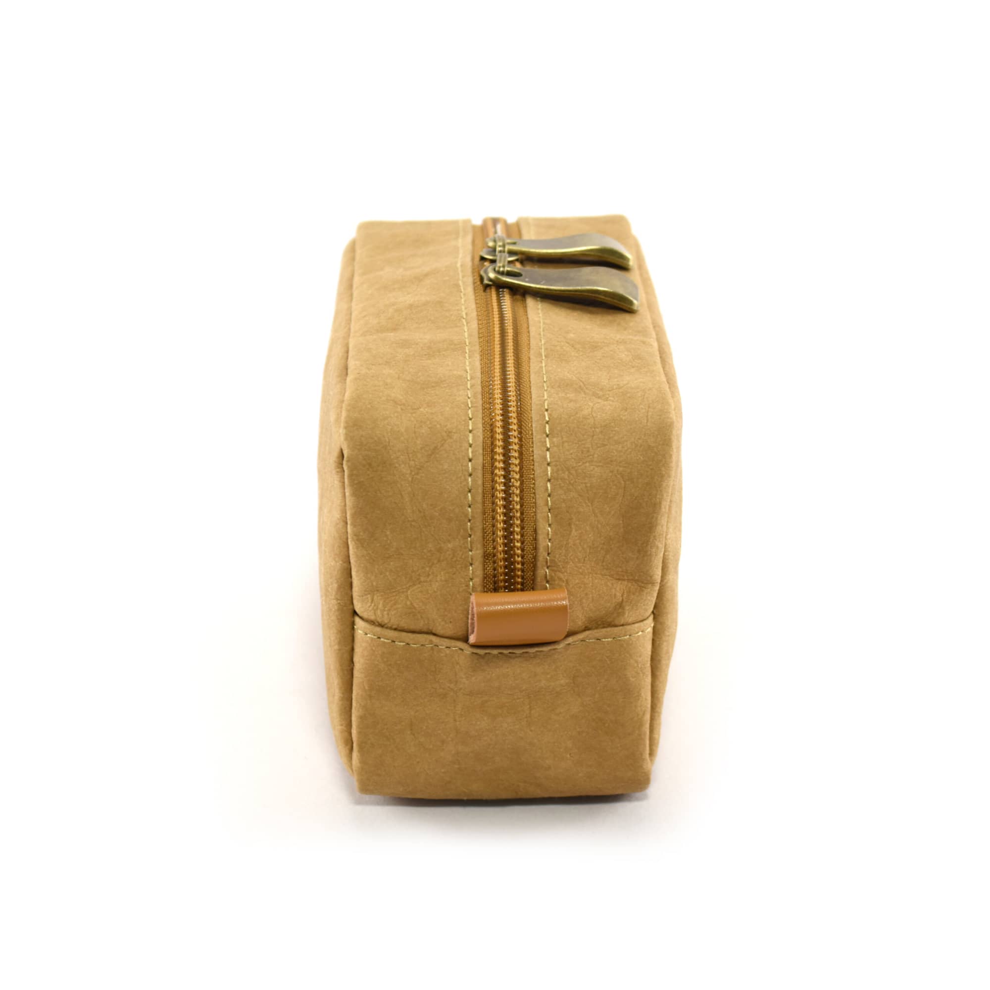 A tan Kraft paper cosmetic bag featuring a zip closure and a simple design, with a small branding logo.