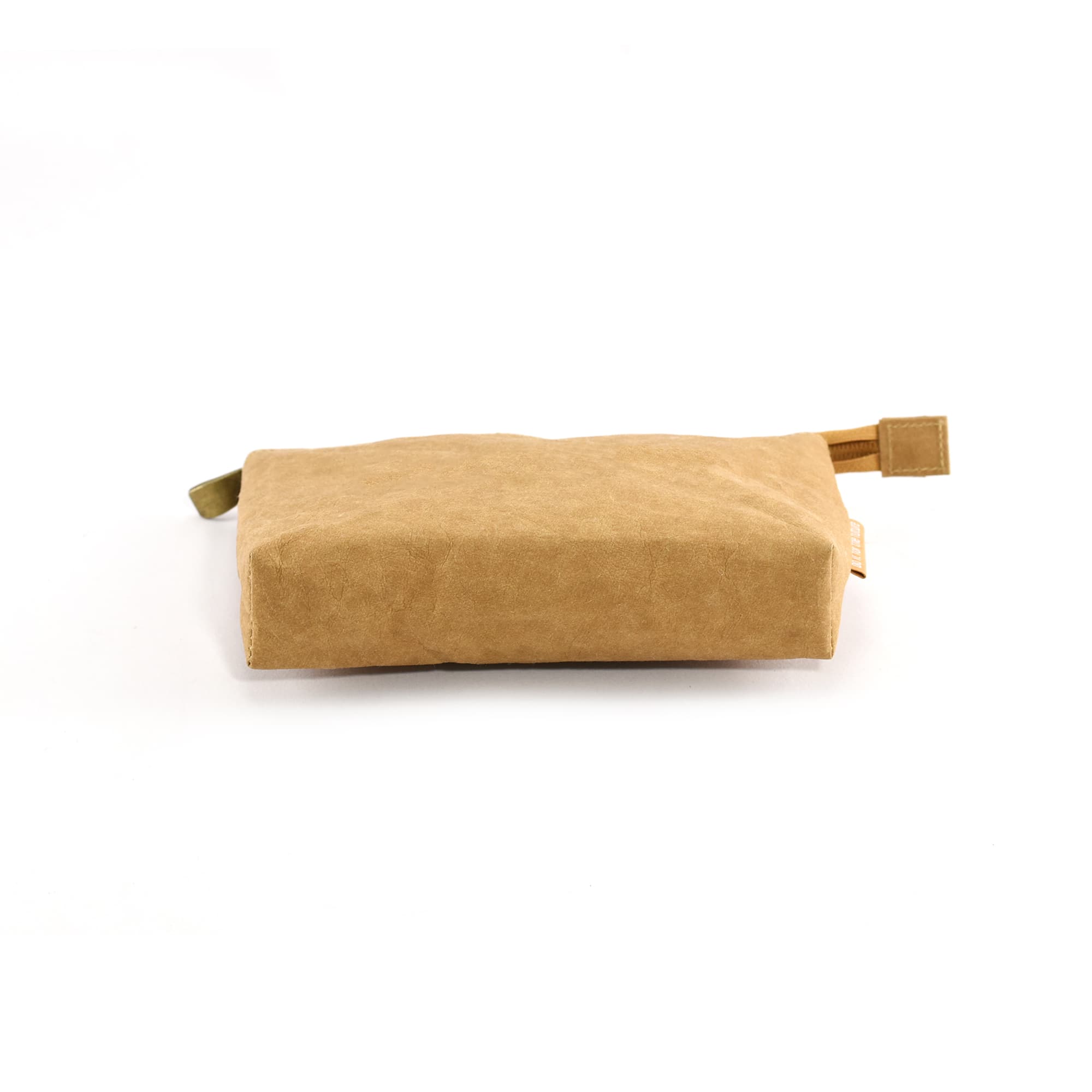 A beige Kraft paper cosmetic bag with a small handle and a logo, flat and rectangular in shape.