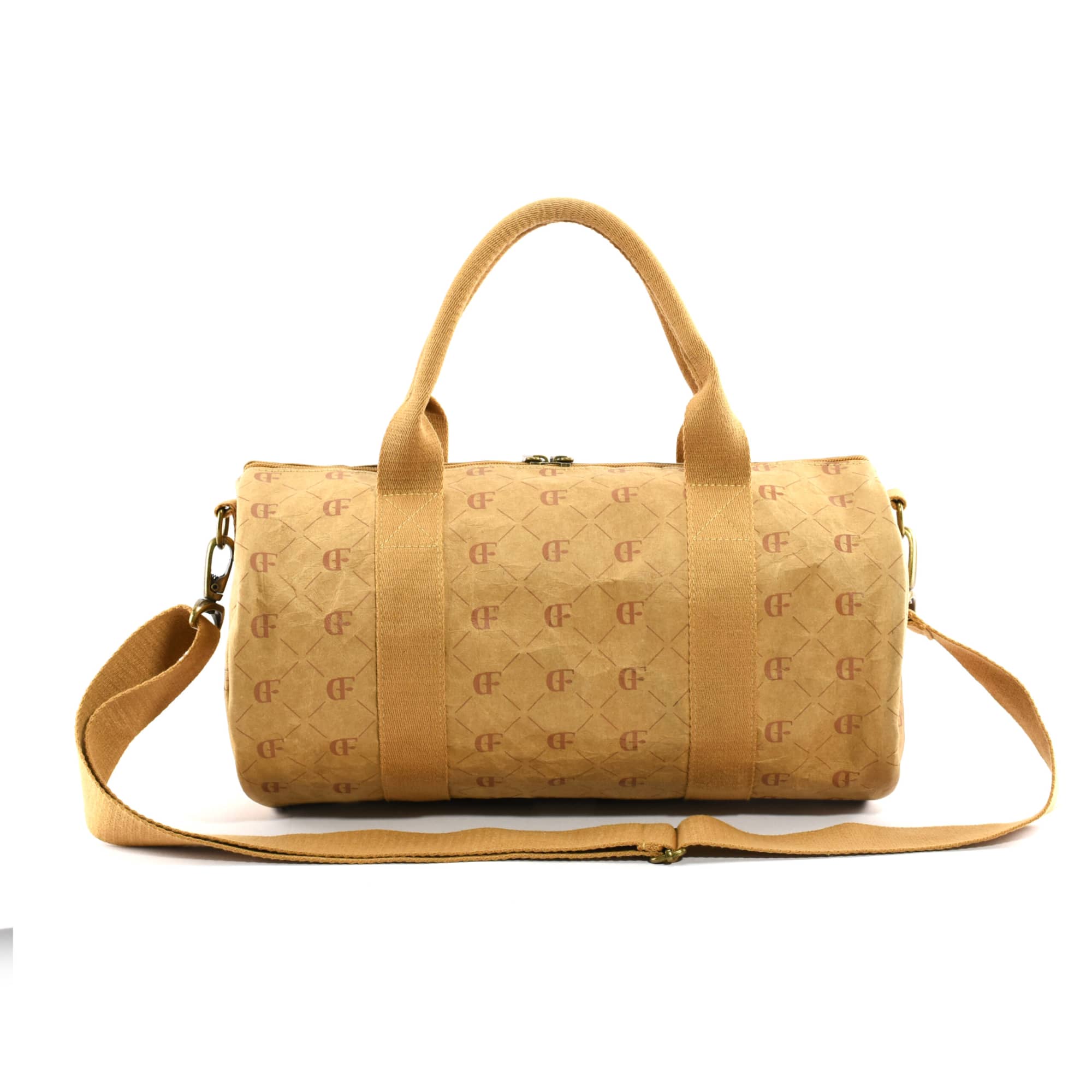 A brown Manila Kraft paper duffle bag with a patterned surface and adjustable shoulder strap.