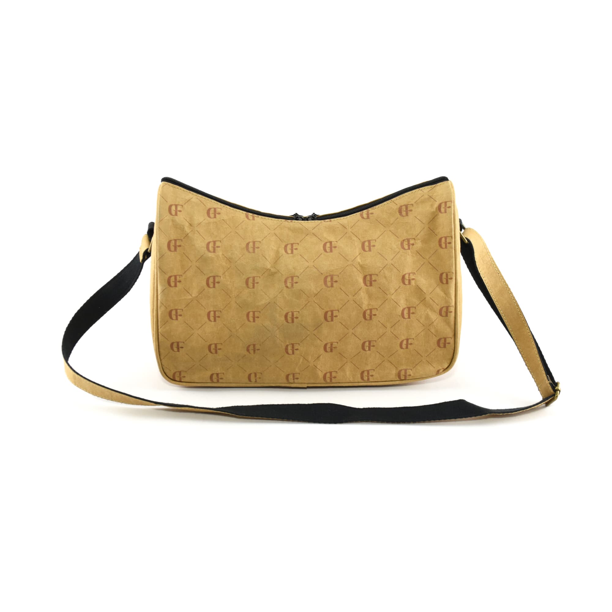 A Karra Kraft paper sling bag in tan, featuring a patterned design and a black shoulder strap. It has a logo on the front.