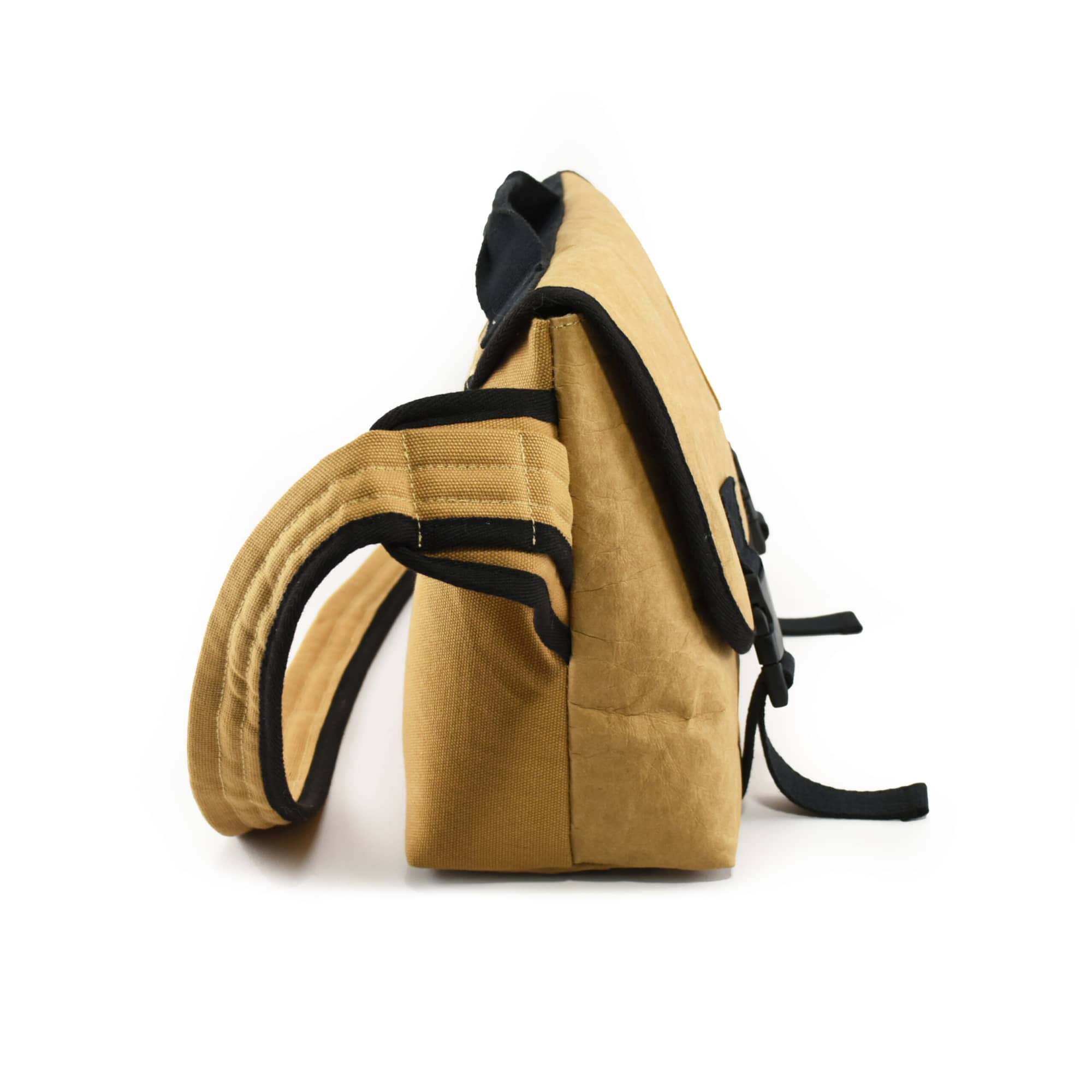 A side view of a brown kraft paper laptop messenger bag with black accents and straps. It has a logo on the front.