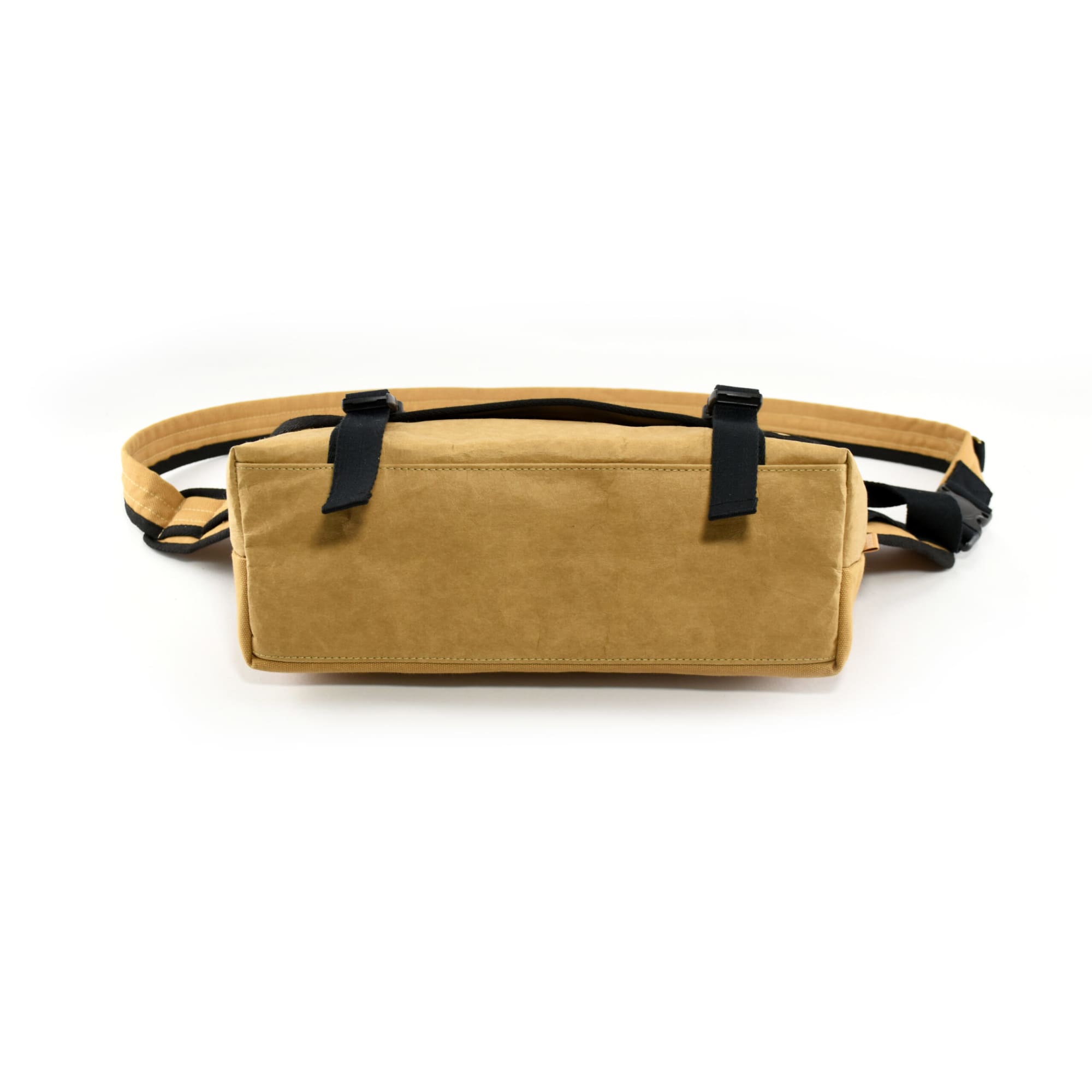 A tan kraft paper laptop messenger bag with black straps, featuring a logo on the front.