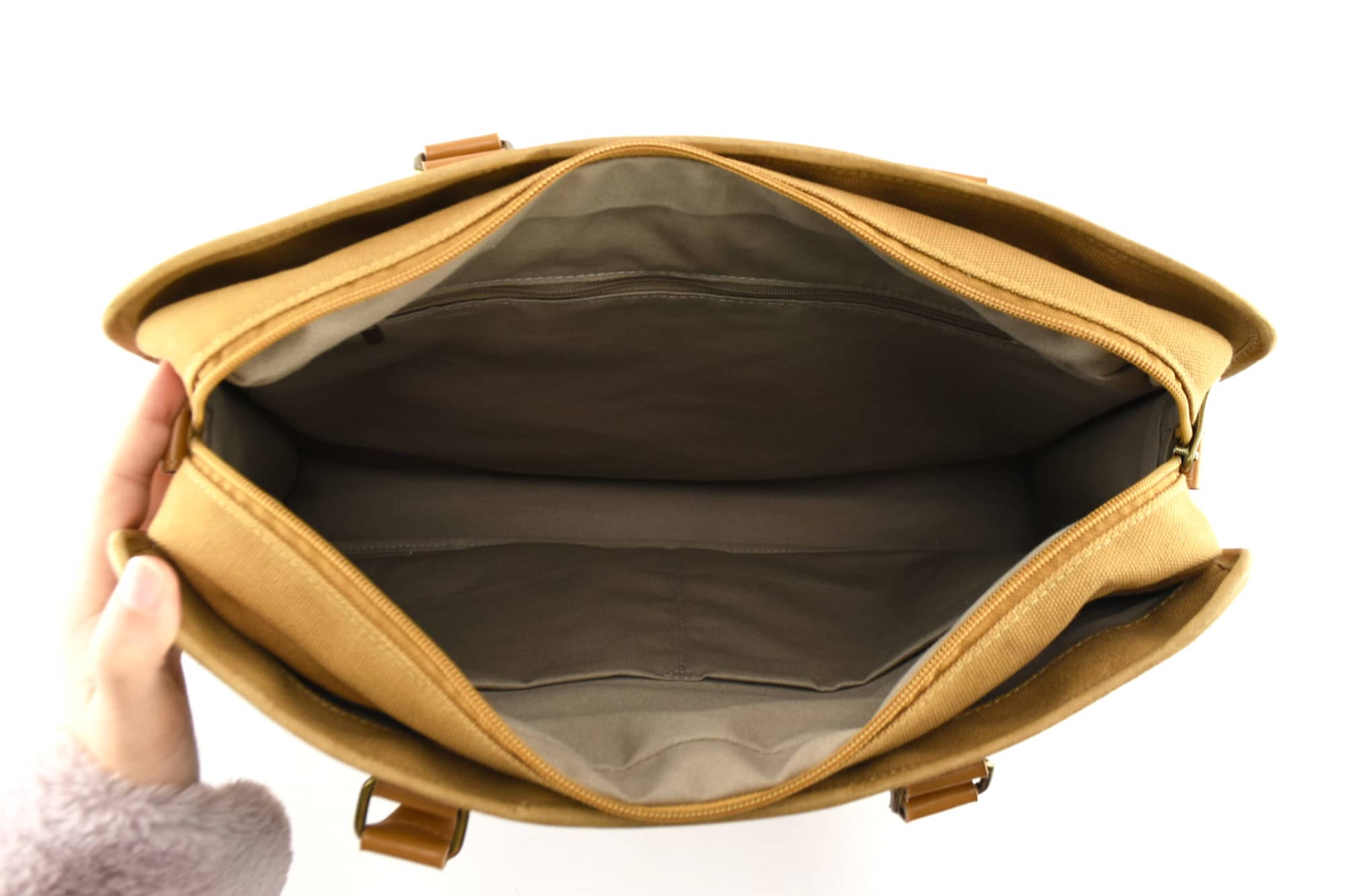 An open Karlo Kraft Paper Conference Satchel in tan colour, featuring multiple compartments and an interior lining.