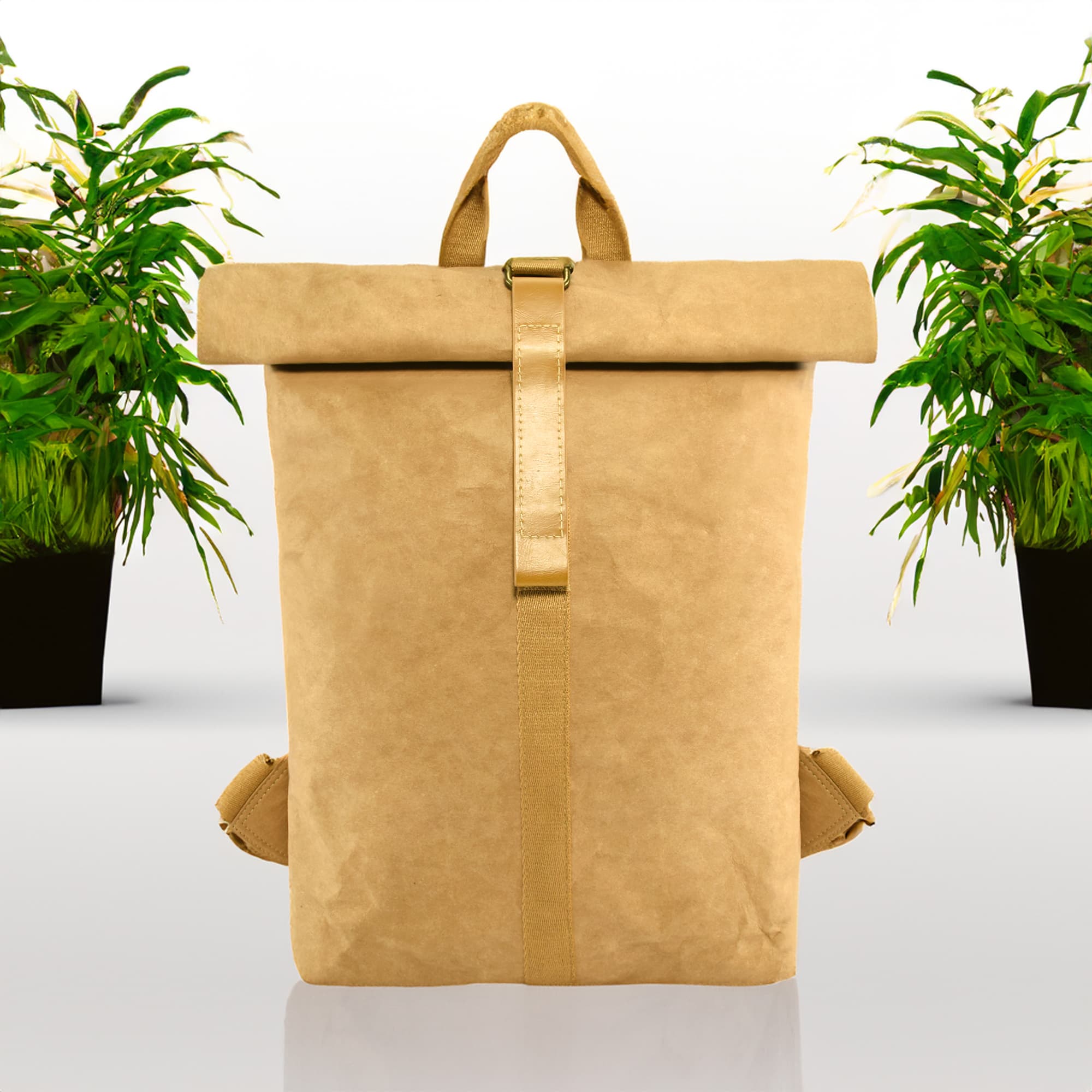 A kraft paper backpack in tan, featuring a roll-top design and a logo, set against a backdrop of potted plants.
