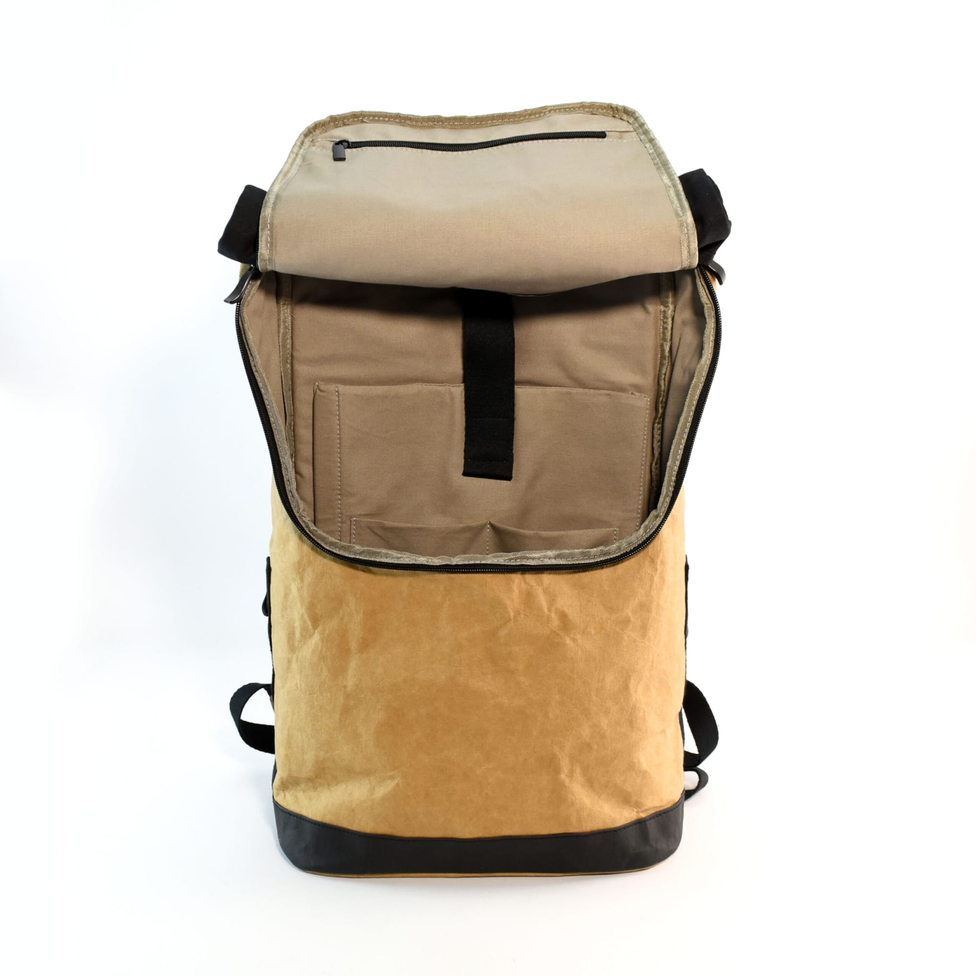 A tan and black Kraft paper laptop backpack with a roll-top closure and interior pocket. Features a logo.