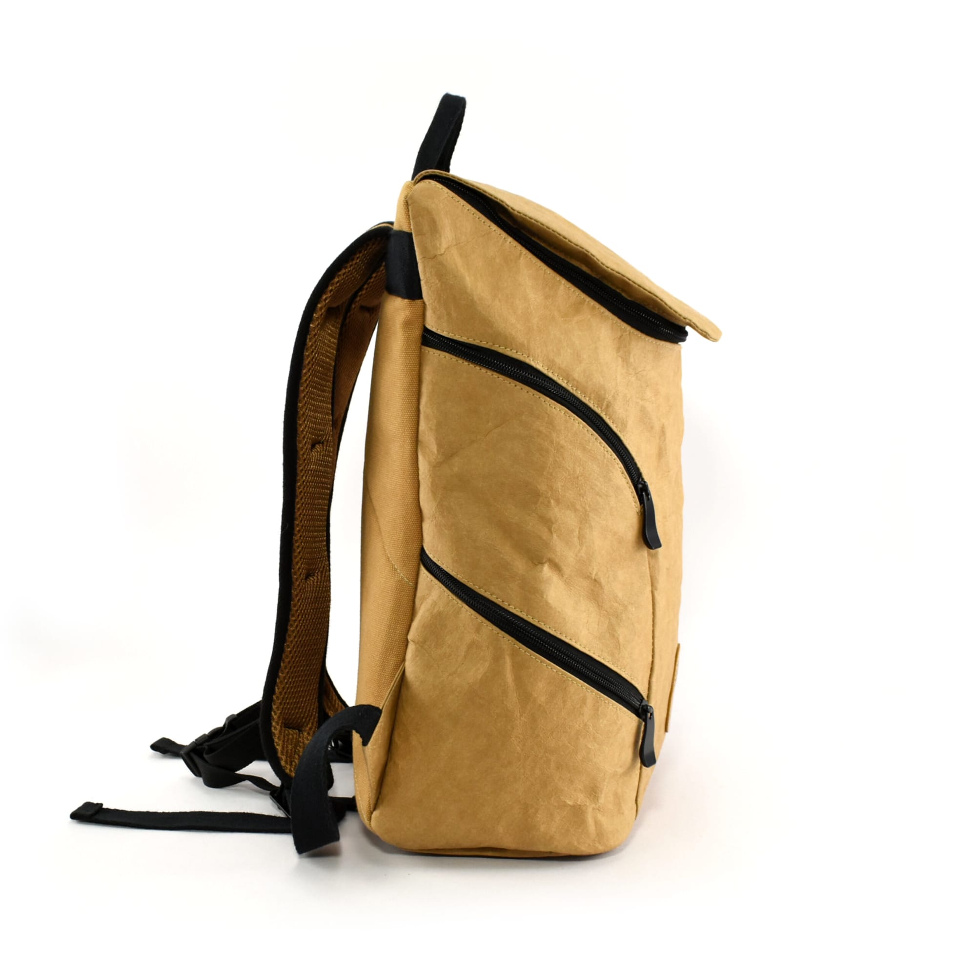 A tan Urban Kraft Paper Laptop Backpack with black accents and multiple zippered compartments.
