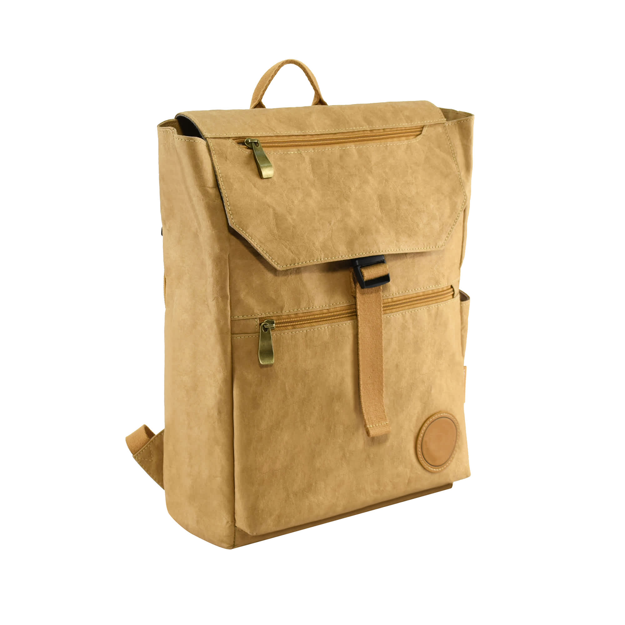 A tan kraft paper backpack featuring a flap closure, adjustable straps, and a front zip pocket. It has a logo on the side.