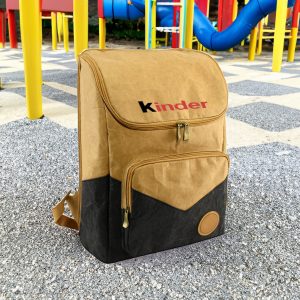 A brown and black Kraft paper laptop backpack with a front pocket and a logo.