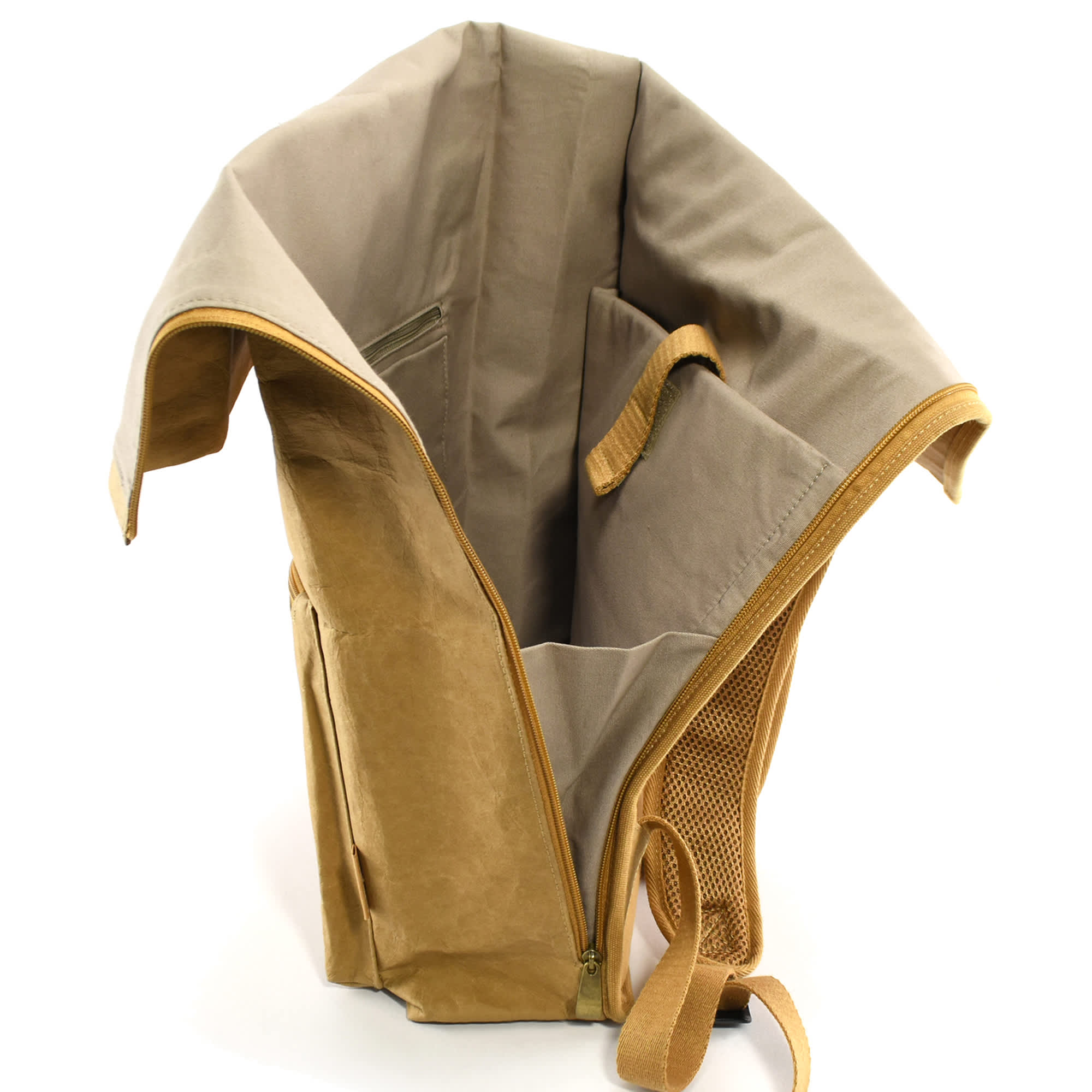 A kraft paper laptop backpack in tan and beige, featuring a spacious interior and a logo.