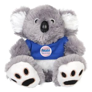 A grey plush koala with a blue shirt and white accents, featuring a small logo on the shirt.