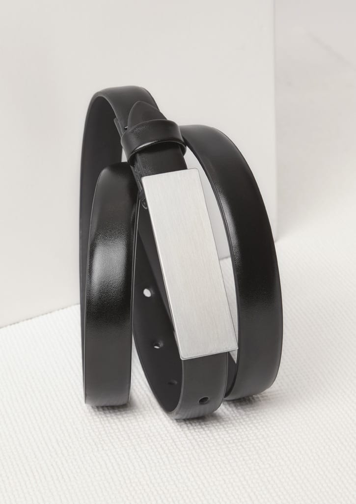 A black women's leather belt featuring a sleek, silver-tone buckle and a minimalist design.