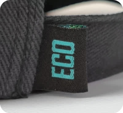 A close-up of a black cap's label featuring the word 