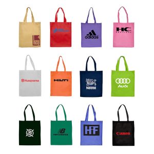 A collection of tote bags in various colours, featuring different logos and brands, arranged in a grid pattern.