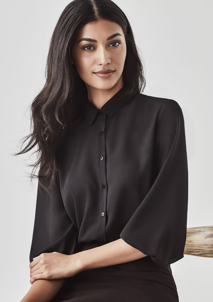 A black 3/4 sleeve blouse with a collar and button-up front, featuring a subtle branding logo.