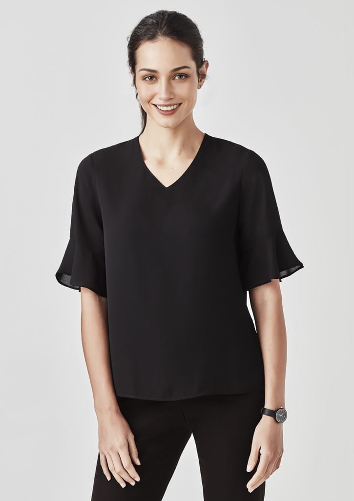 A black fluted sleeve blouse displayed on a model, featuring a V-neck and a sleek design. It includes a logo.