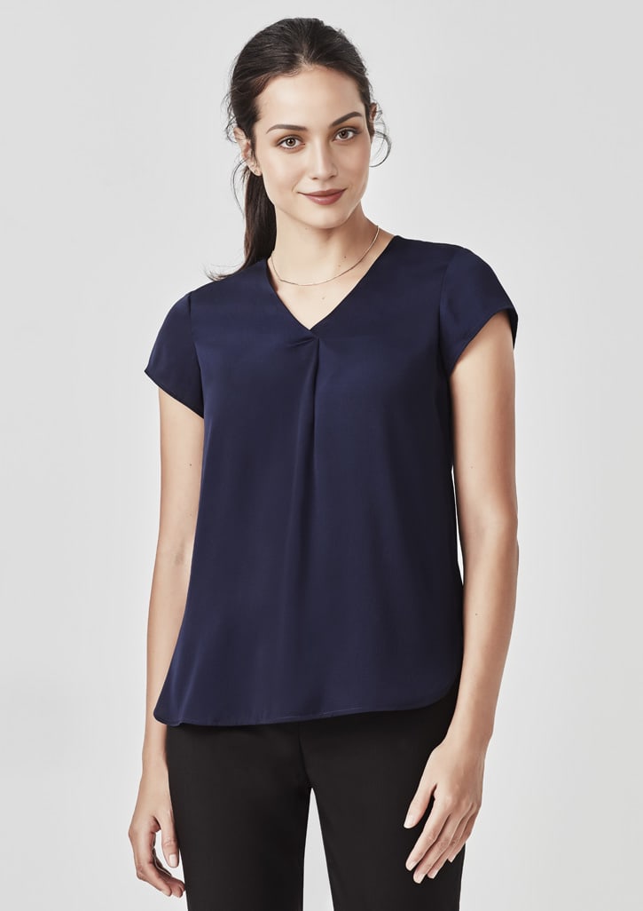 A navy blue women's blouse featuring a V-neck and pleat detail, styled with short sleeves and a relaxed fit.