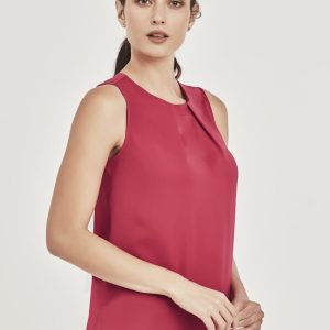 A sleeveless blouse in deep red with pleat detail, featuring a rounded hem and a subtle brand logo.