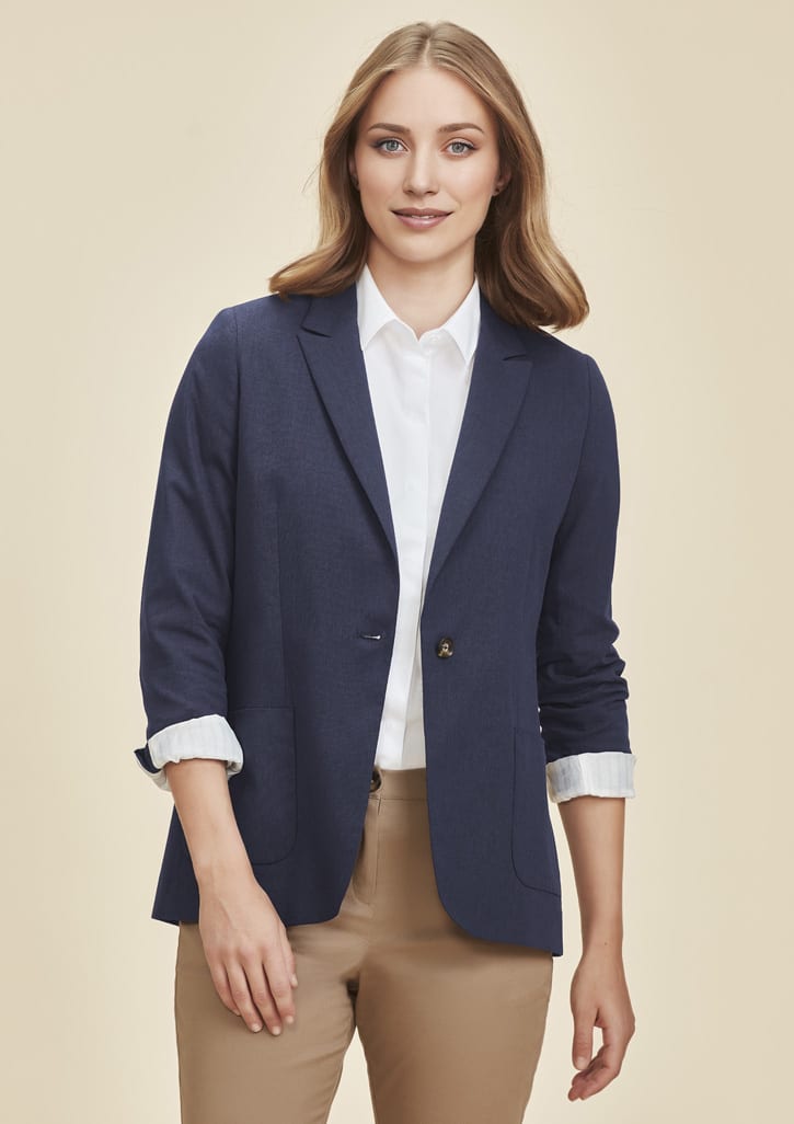 A women's blazer in navy blue, featuring a classic design with rolled-up sleeves and a logo on the lapel.
