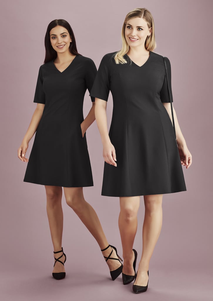 A black extended short sleeve dress displayed on two models, featuring a V-neck and a flared silhouette, with a logo visible.