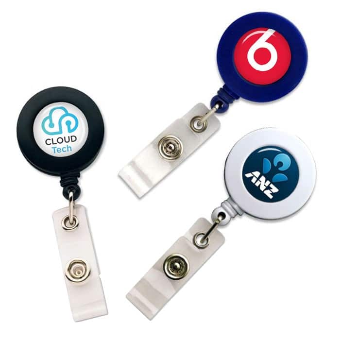 Three retractable ID card holders in black, blue, and silver, each featuring a different logo.