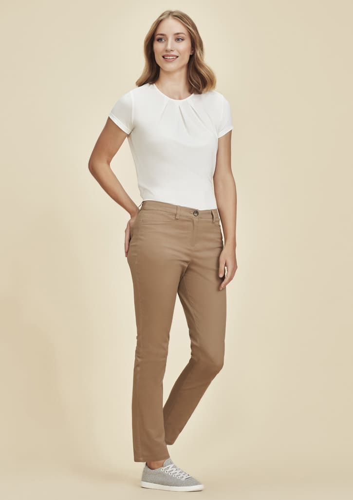 Women's slim leg stretch chino pant in tan, paired with a white top, featured on a neutral background.