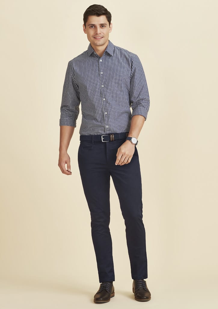 Men's tapered stretch chino pants in navy, paired with a checked shirt, featuring a belt and shoes.